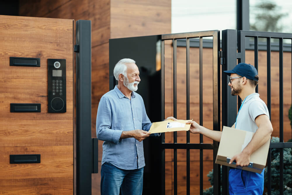 smiling senior man receiving a home delivery from 2026 03 17 07 03 39 utc.jpg